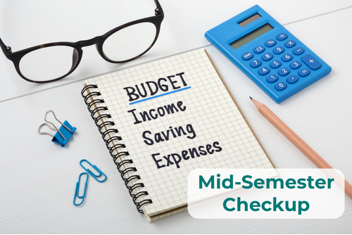 A spiral notebook displays the words Budget, Income, Savings and Expenses